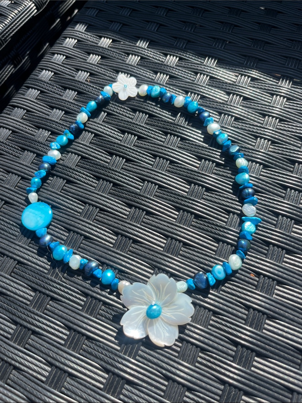 Blue Beaded Necklace with Mother-of-Pearl Flower Pendant